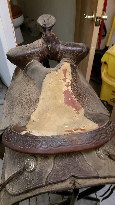 top view of rose pattern saddle before restoration
